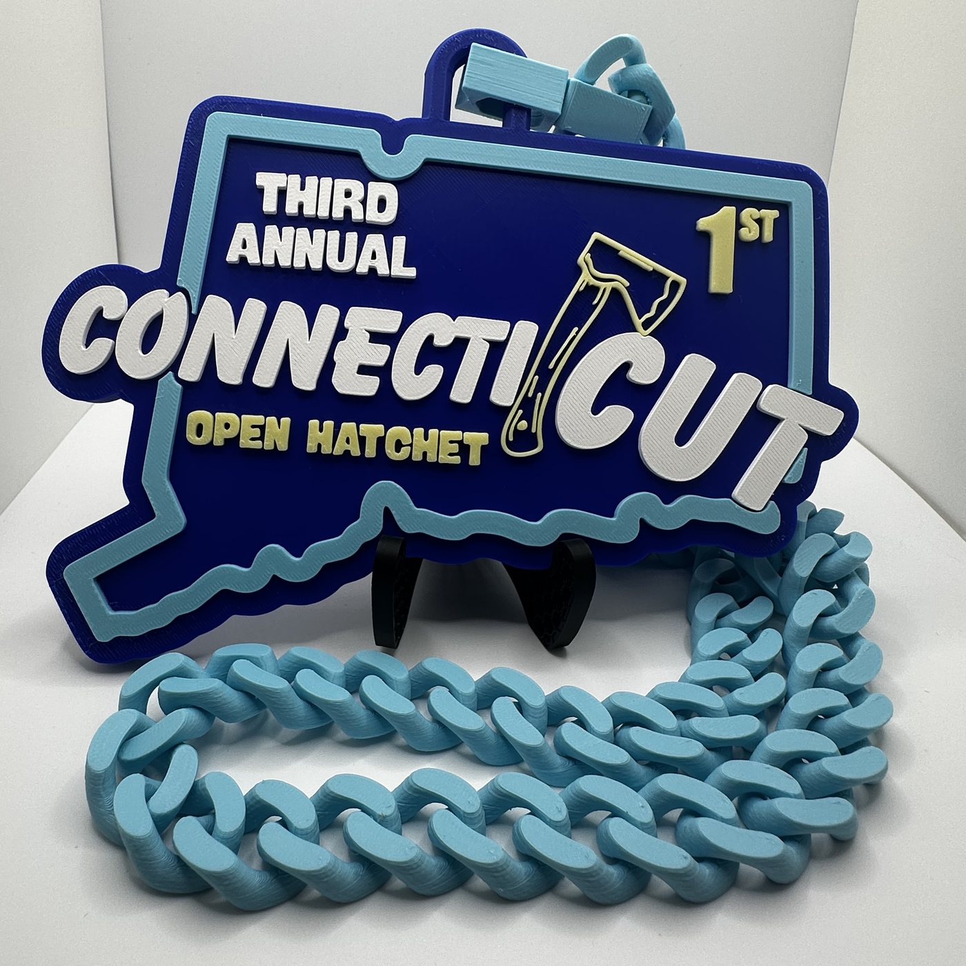 ConnectiCUT 2026 first place hype chain, Connecticut-shaped medallion on a printed chain