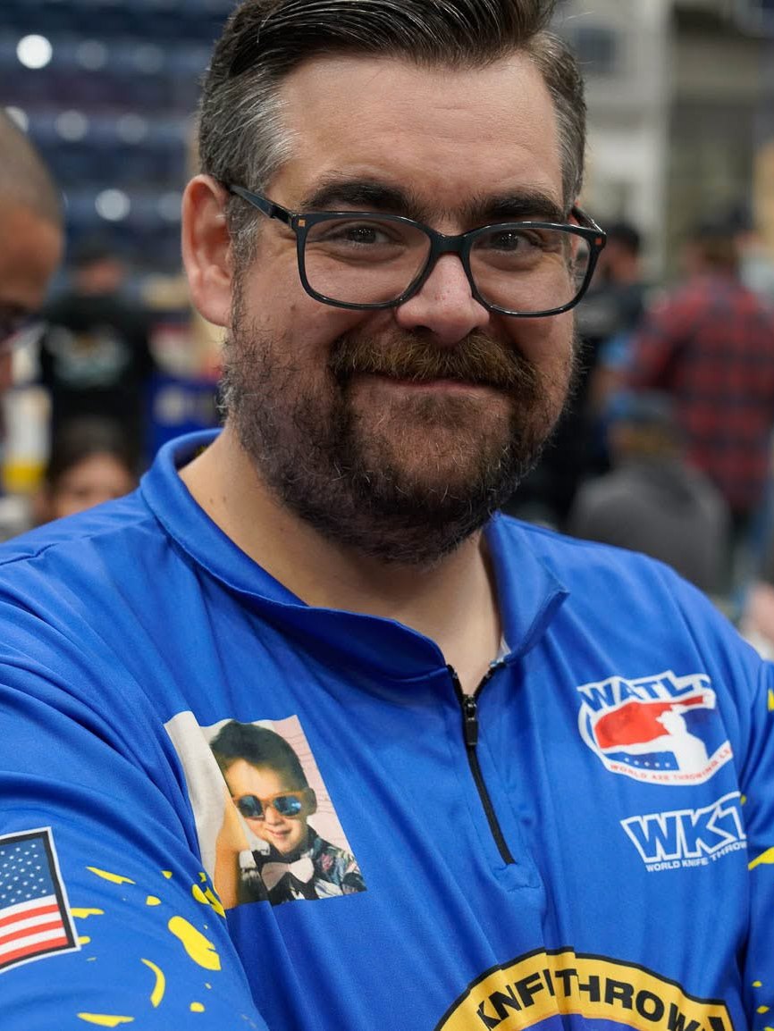 Michael DiChello, founder of Project Bullseye, in a WATL competition jersey at an axe throwing tournament