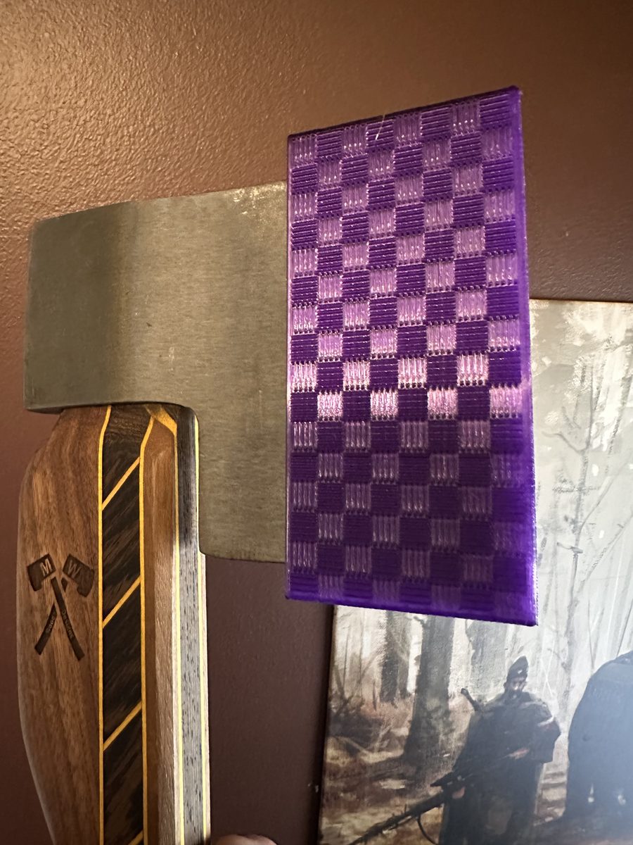 Purple checkerboard sheath on hatchet