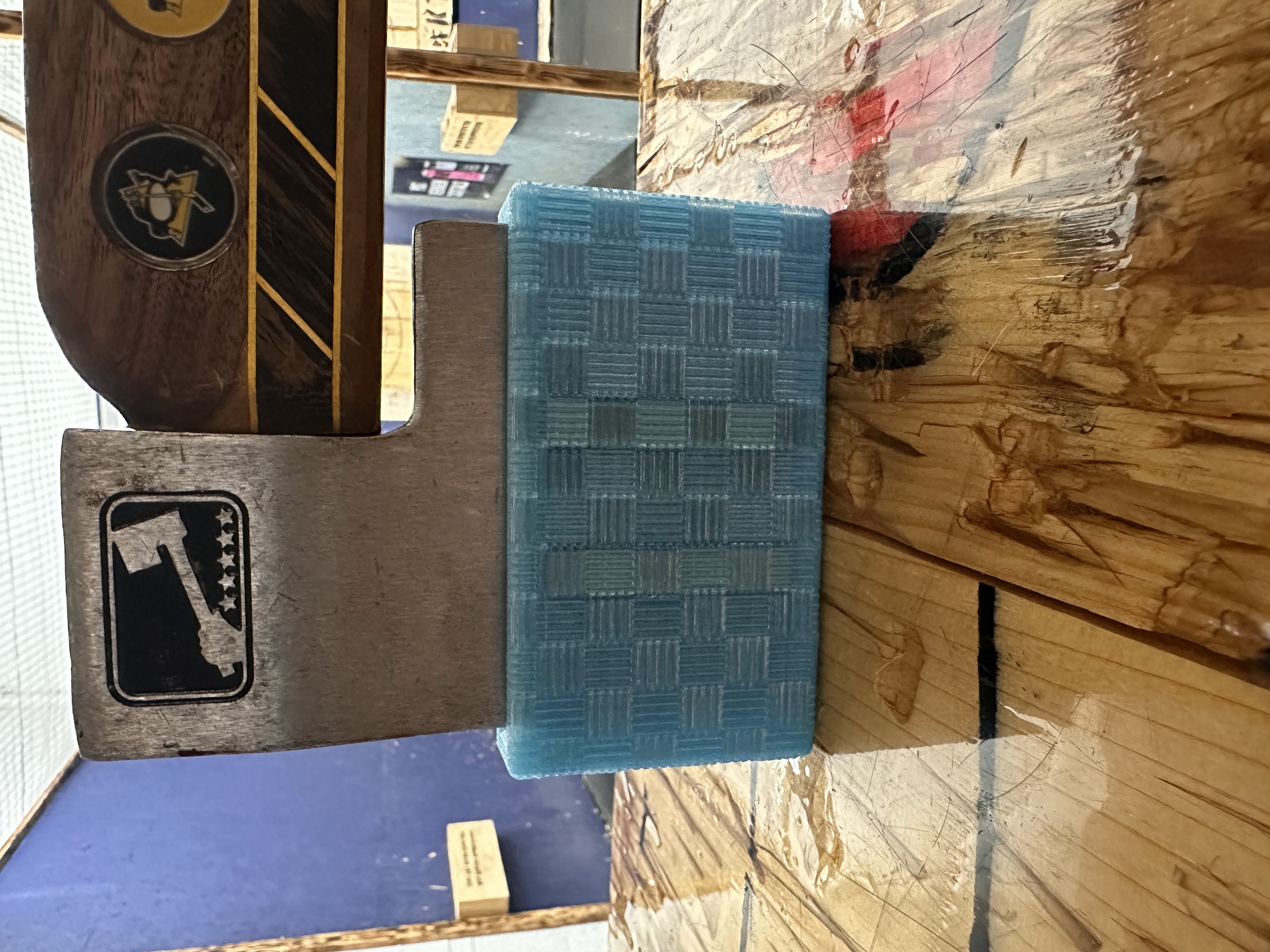 Teal checkerboard custom sheath at Cutting Edge
